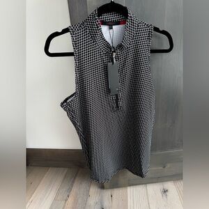 Silky soft Greyson black and white “wolvestooth” print sleeveless golf top.